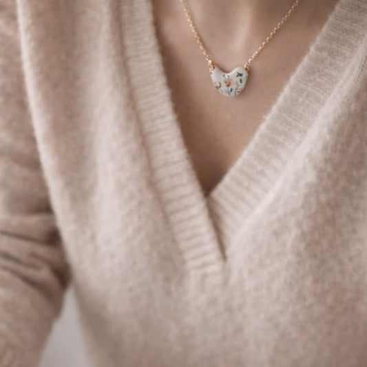 Little Bird necklace detail – the signature of Joska Handmade, 24k gold ceramic decoration