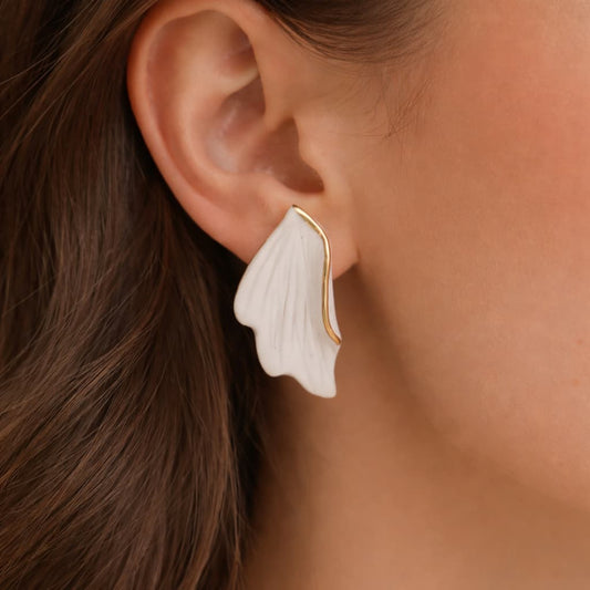 Breeze earrings detail – light airy strokes with 24k gold ceramic decoration, by Joska Handmade