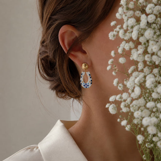 Alma do Mar earrings detail – ocean-inspired motif with 24k gold ceramic decoration, by Joska Handmade