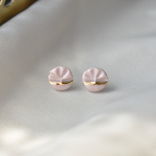 Half Wavy earrings detail – fluid wave motif with 24k gold ceramic decoration, by Joska Handmade