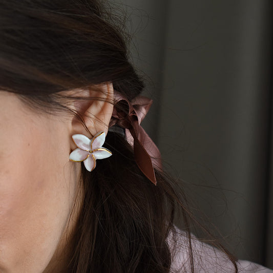 Star Flowers earrings detail – floral and star motif with 24k gold ceramic decoration, by Joska Handmade