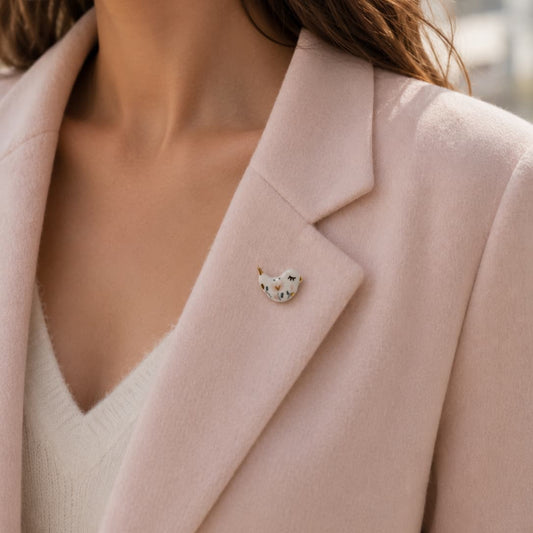 Hand-painted Little Bird brooch with delicate feather detailing by Joska Handmade